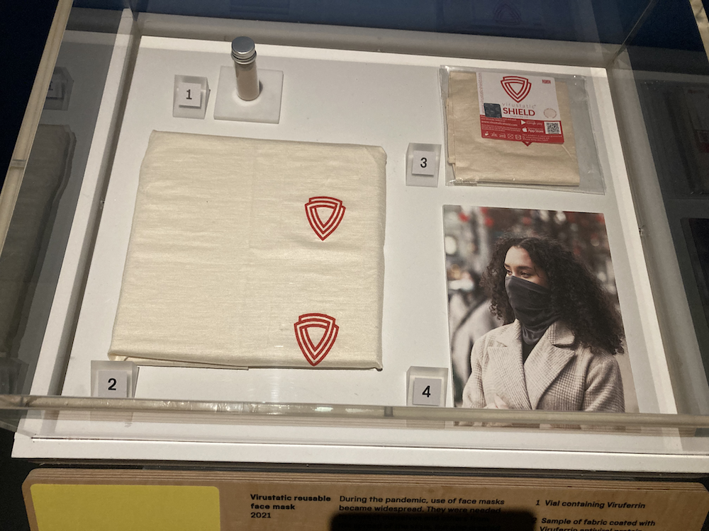 Display case with Virustatic reusable face mask.