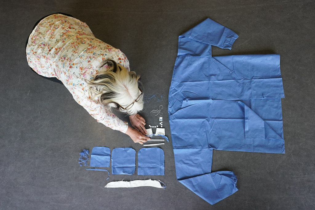 A researcher lays out the many components of a seemingly simple single-use jacket.