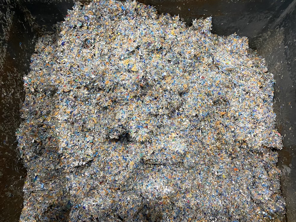A close up of discarded and compressed plastic medical waste