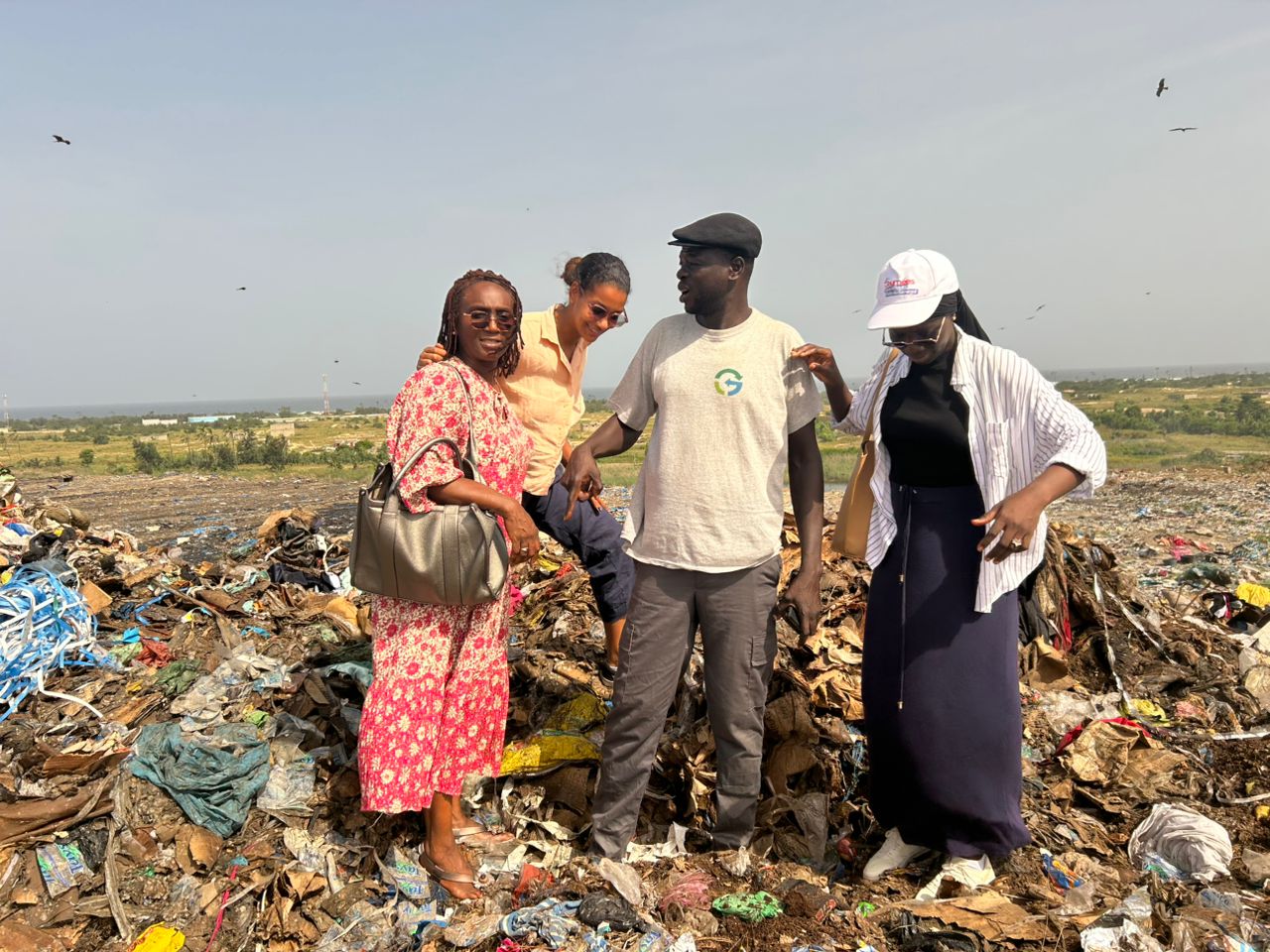 Research team stand on top the dumpsite platform.