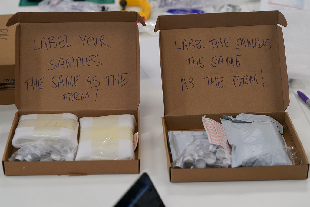 Boxes containing single-use devices to be deconstructed with instructions on labelling the samples.