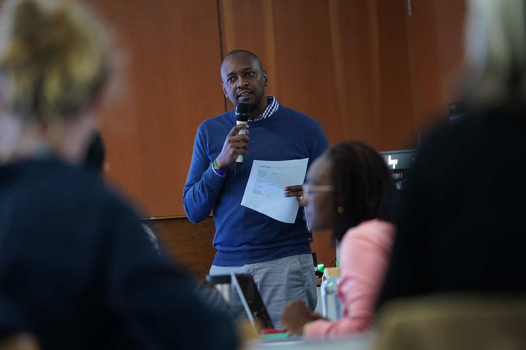 Dr. Mangesho introducing the core research question