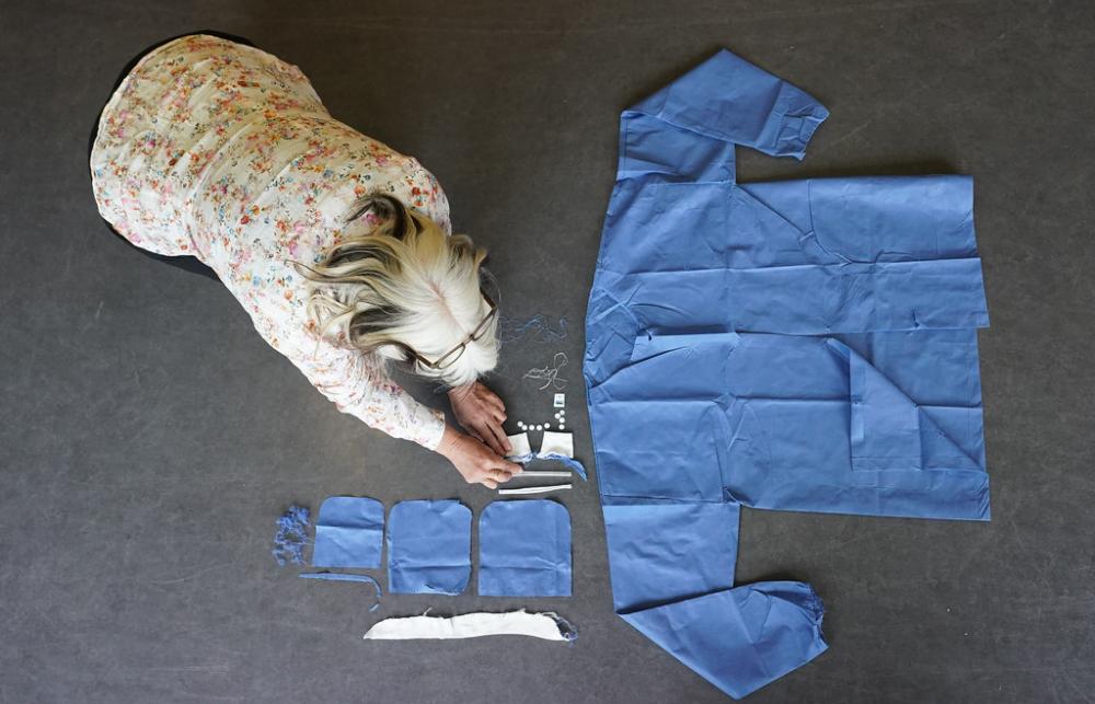 A researcher lays out the many components of a seemingly simple single-use jacket.
